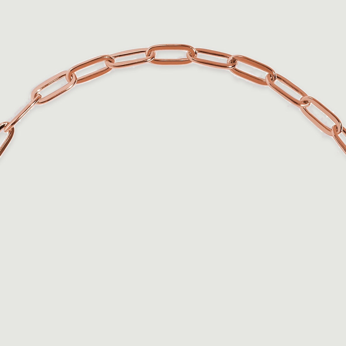 Polished elongated links curve across the upper arc of the rose gold bracelet.