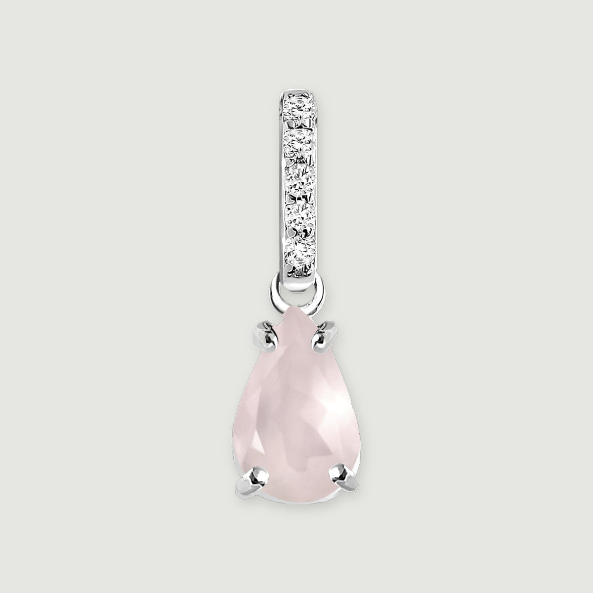 A pear-shaped pink rose quartz pendant hangs beneath a row of five clear stones in silver on a light gray background.