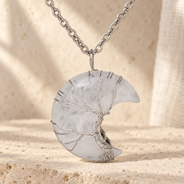 Cloudy white crescent pendant wrapped in a silver-toned wire tree.