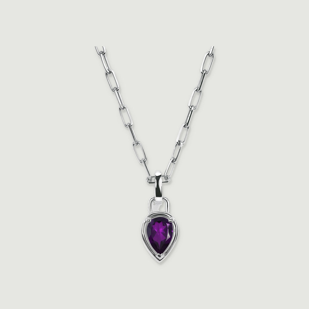 A white rhodium plated necklace shows a faceted purple pear-shaped stone below a polished bail.