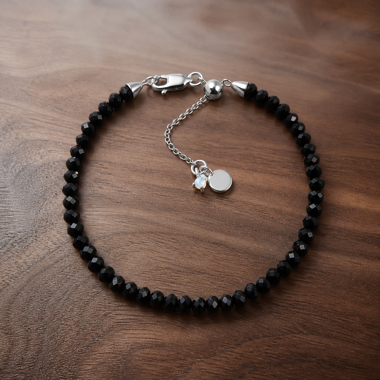 Night Shield black obsidian bracelet in 925 sterling silver on warm walnut