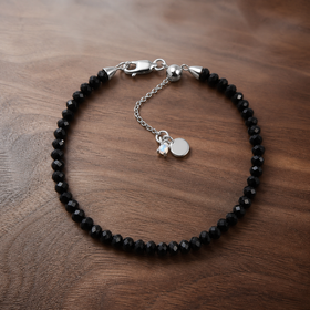Night Shield black obsidian bracelet in 925 sterling silver on warm walnut