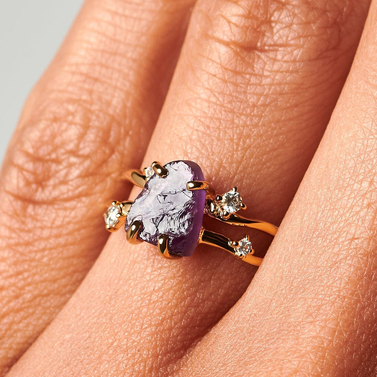 10kt yellow gold amethyst ring worn close on a hand