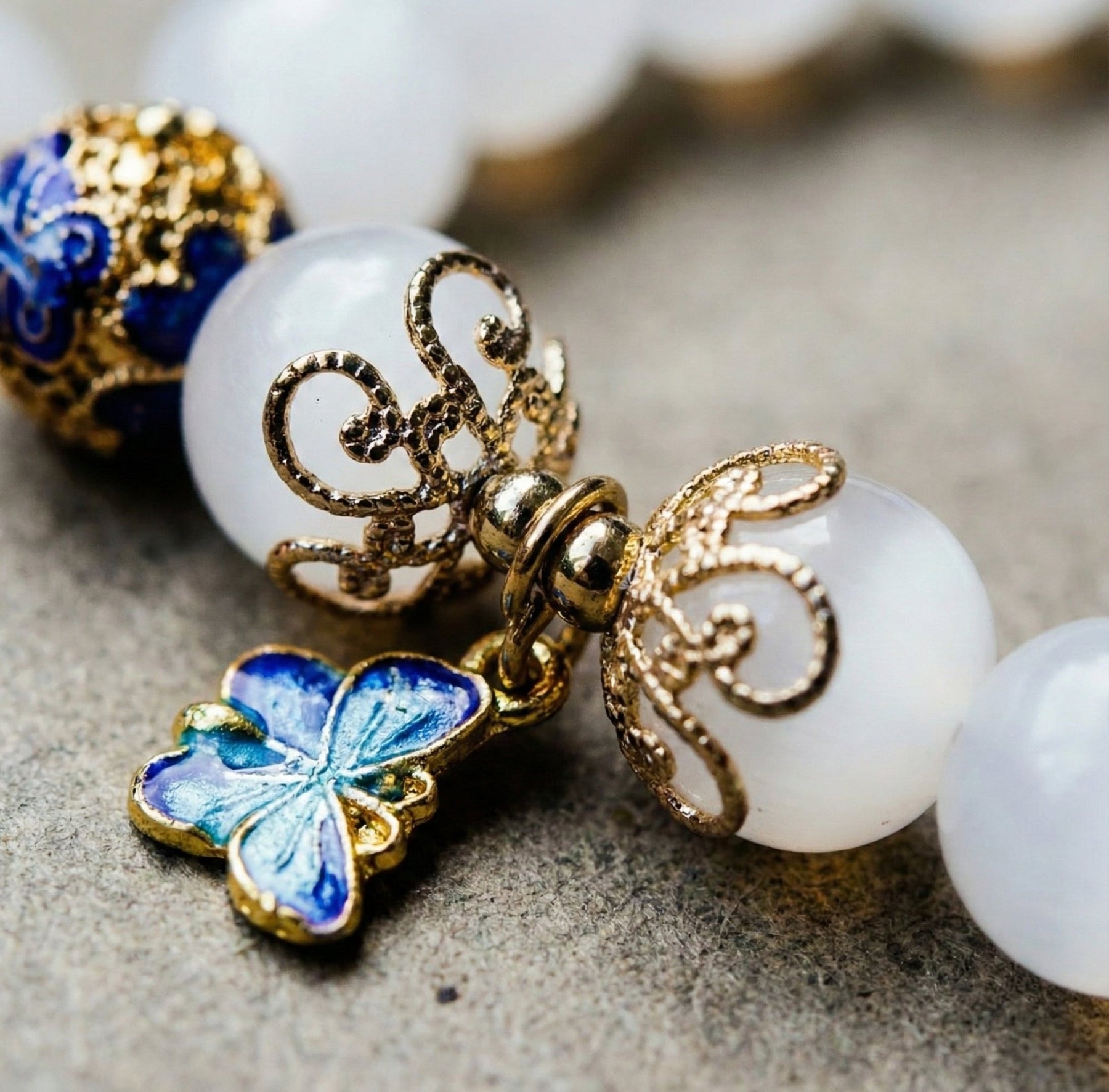 Celestial Wings: Moonstone & Blue Enamel Butterfly Bracelet