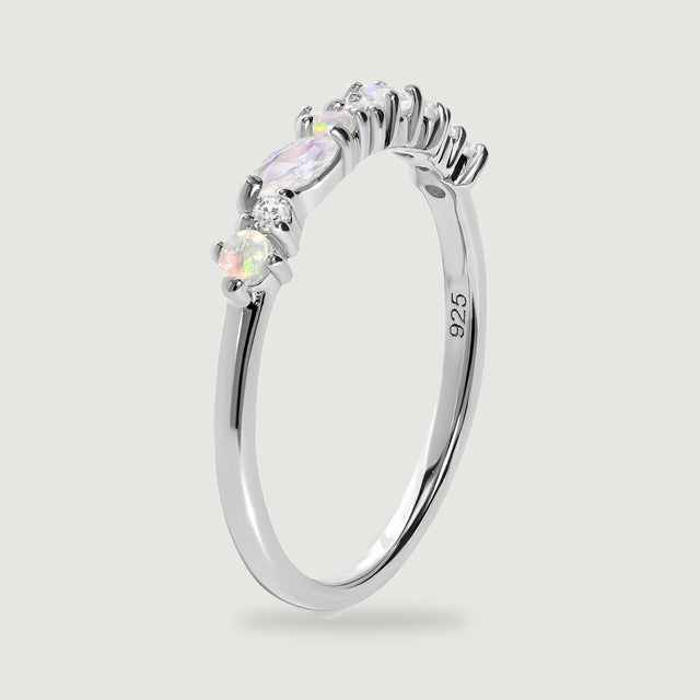A side view of the silver ring reveals the open underside of its gemstone settings and the inner 925 stamp.