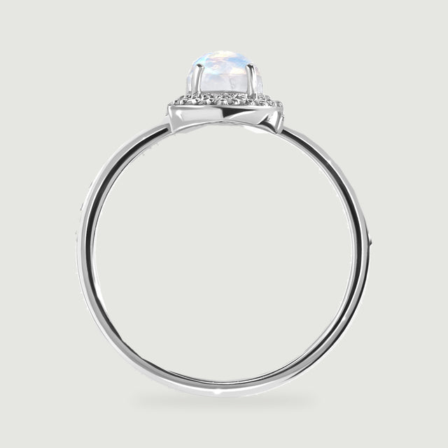 The white gold ring profile reveals the moonstone above its diamond halo and open circular band.