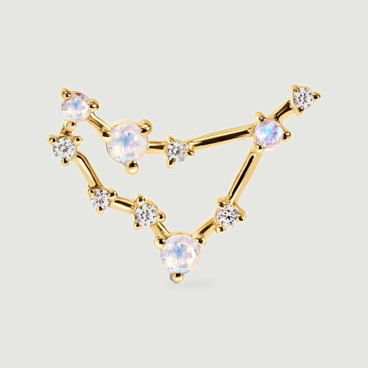 The yellow gold earring is shown from the front with clear accent stones between the larger round moonstones.