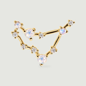 The yellow gold earring is shown from the front with clear accent stones between the larger round moonstones.