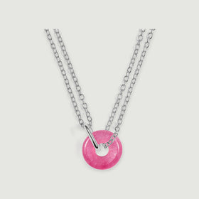 Silver links and a curved silver connector hold a round pink quartz pendant on a pale gray background.