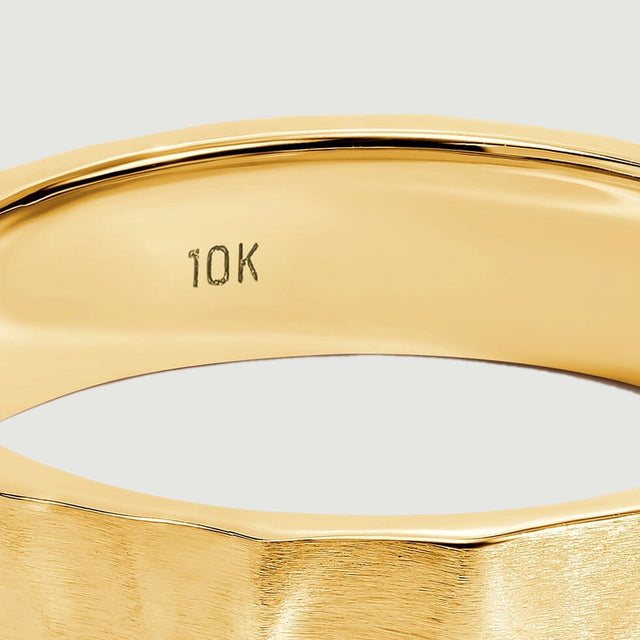 The inside of the yellow gold band shows a small 10K stamp below a polished rim.