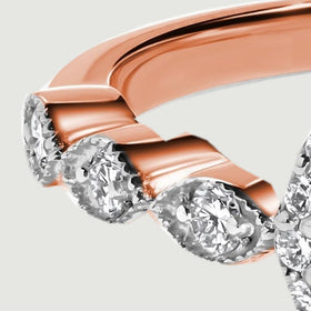 The left shoulder shows curved rose gold sections alternating with bright diamond accents.