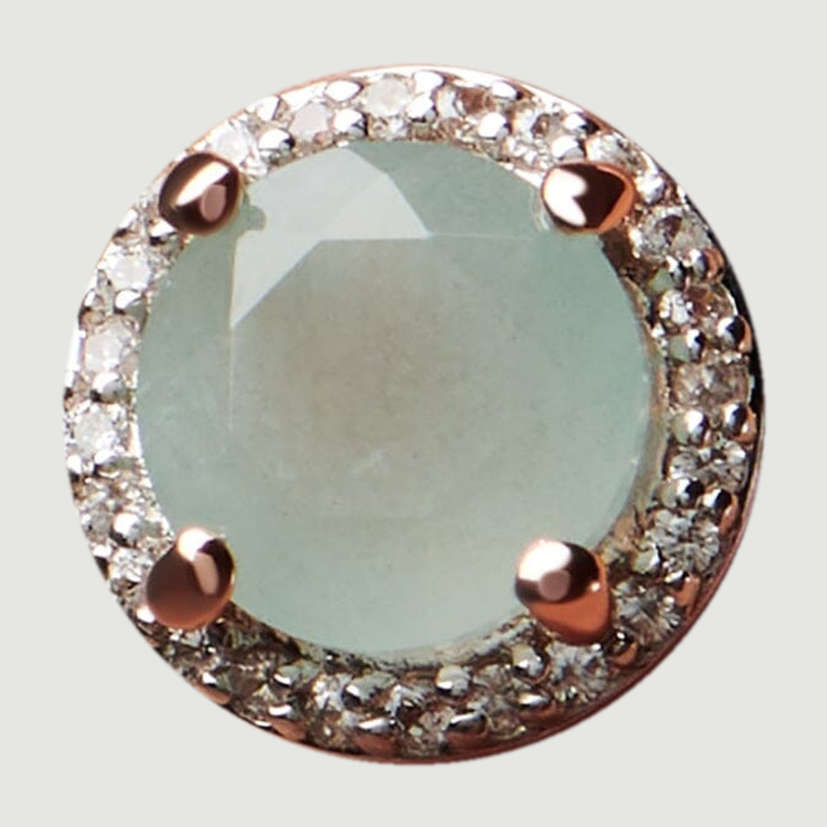 A top view shows the faceted pale blue aquamarine encircled by clear diamonds and four rose gold prongs.