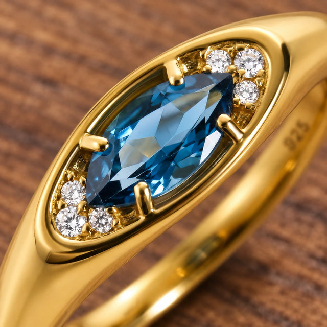 Clear Horizon blue topaz eye ring, gold macro