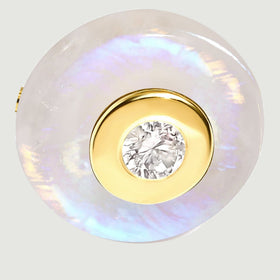 A close-up shows the yellow gold vermeil bezel surrounding a clear center stone within a round moonstone disc.