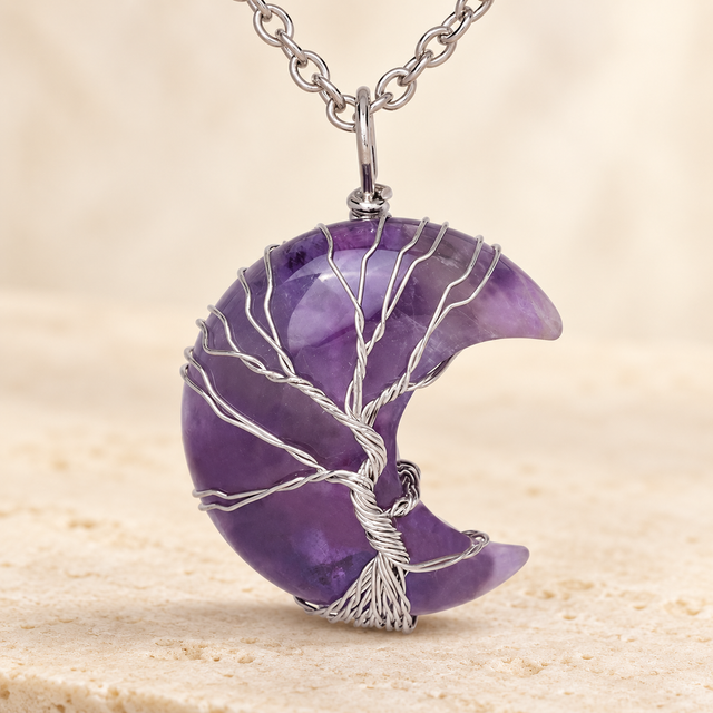 Purple crescent pendant with a wire-wrapped tree