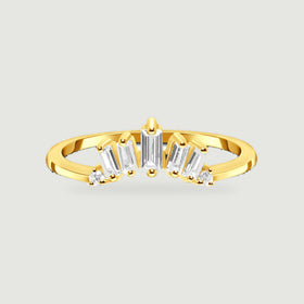 A yellow gold vermeil ring displays five graduated baguette stones and two round stones on a light gray background.
