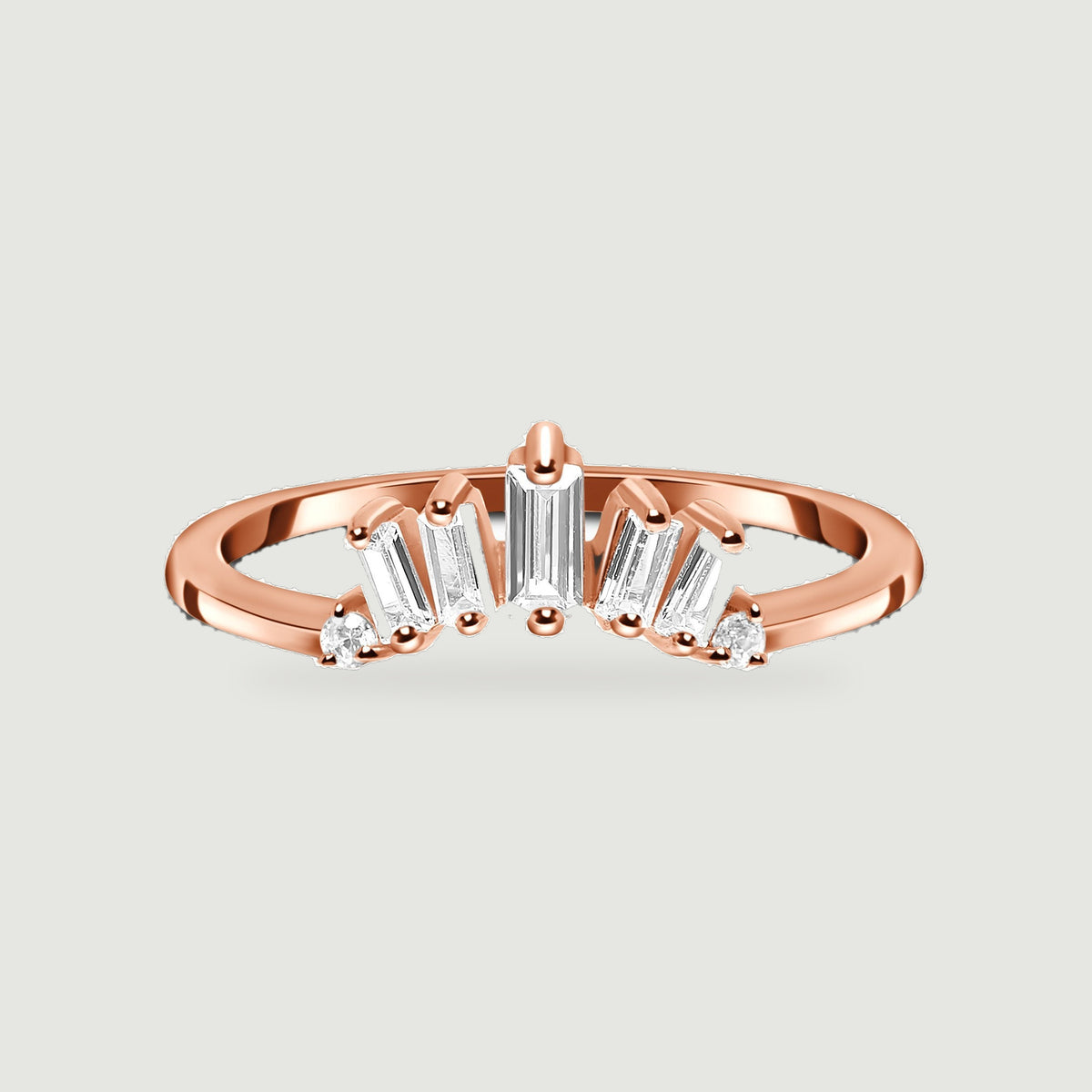 A rose gold vermeil band holds a fan of clear rectangular stones with round accents at both ends.