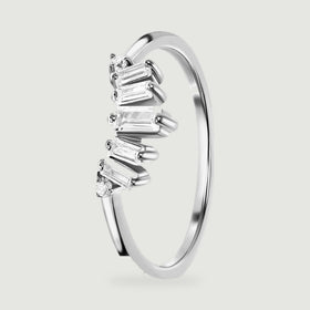 An angled sterling silver band reveals the open space beneath its clear stones and the smooth inner curve.