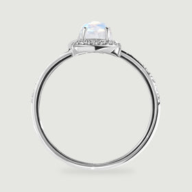 The white gold ring is shown from the side with raised prongs and a polished circular band.