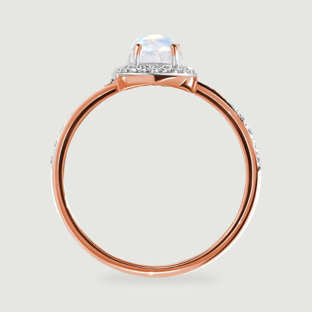 The rose gold band and prongs are visible beneath the pale iridescent moonstone in profile.