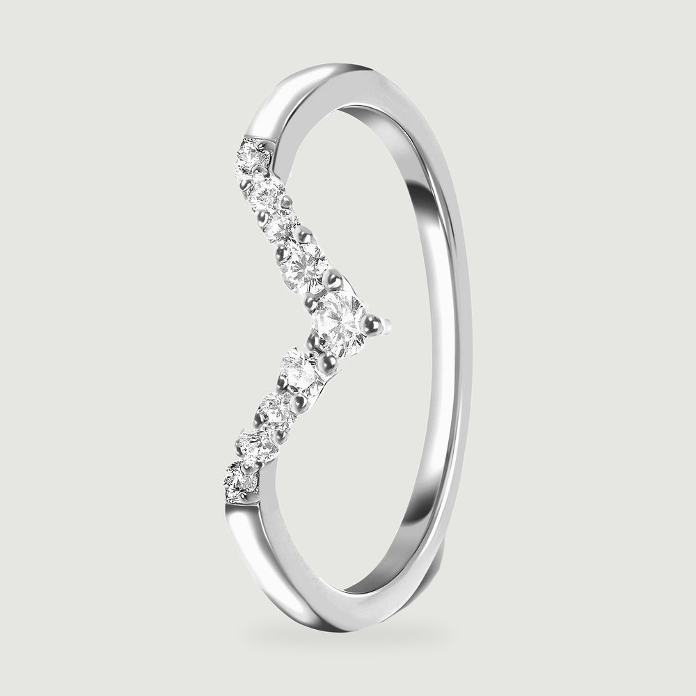 An upright silver ring reveals the raised clear stones and the inside of its slim band.