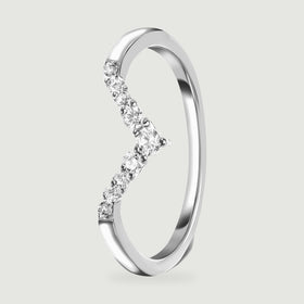 An upright silver ring reveals the raised clear stones and the inside of its slim band.