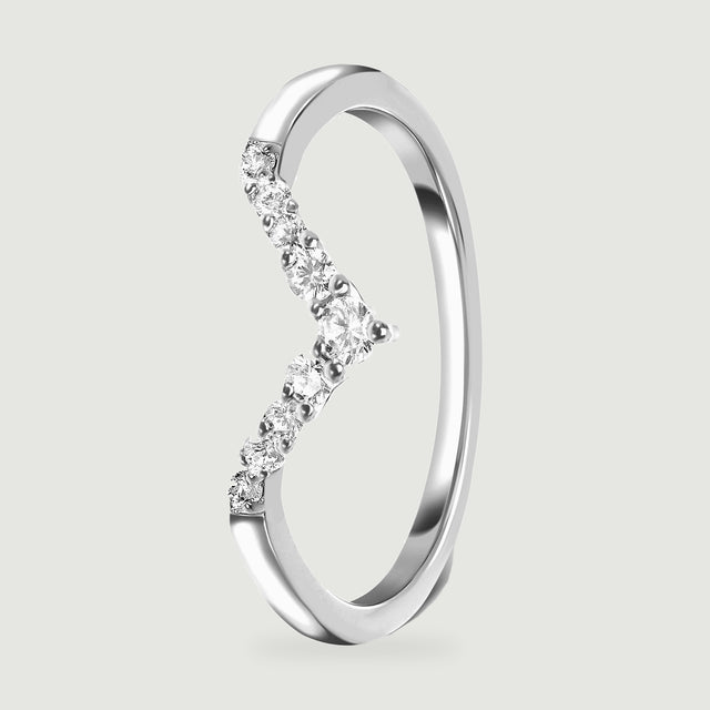 An upright silver ring reveals the raised clear stones and the inside of its slim band.