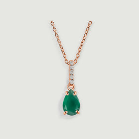 A rose gold chain holds a green teardrop pendant with four prongs and a clear-stone bail.