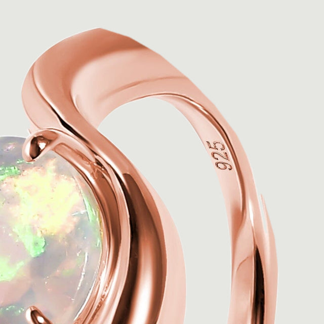 A close view shows the smooth rose gold band and the 925 stamp on its inner surface.