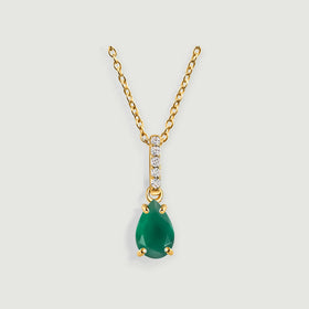 A green pear-shaped pendant hangs below a yellow gold bail set with five clear stones.