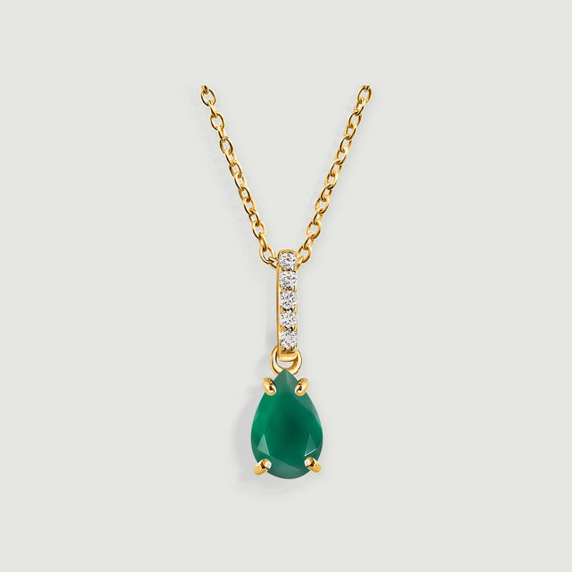 A green pear-shaped pendant hangs below a yellow gold bail set with five clear stones.