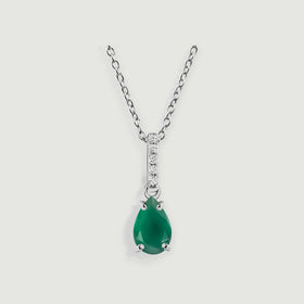 A silver chain holds a green pear-shaped pendant beneath a narrow diamond-set bail.