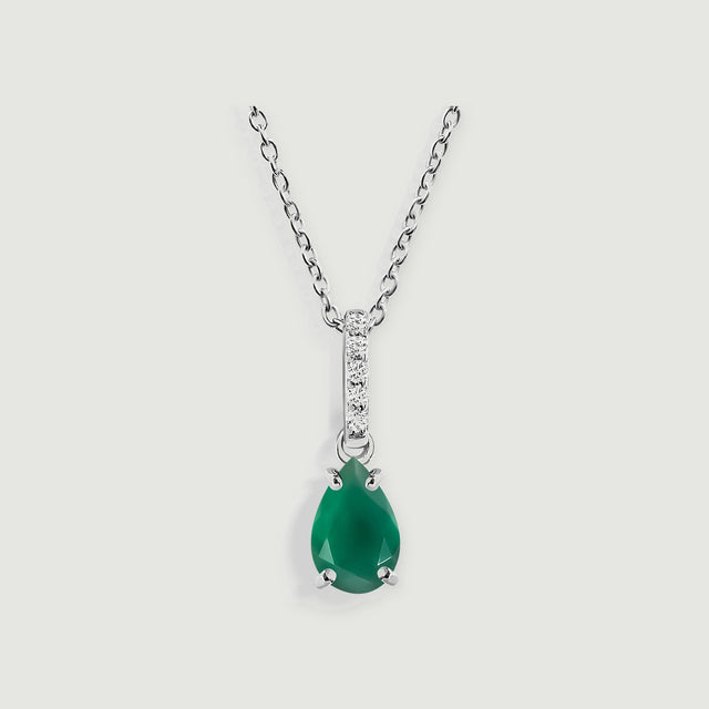 A silver chain holds a green pear-shaped pendant beneath a narrow diamond-set bail.