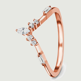 An angled rose gold band reveals the raised clear stones and its smooth curved shank.