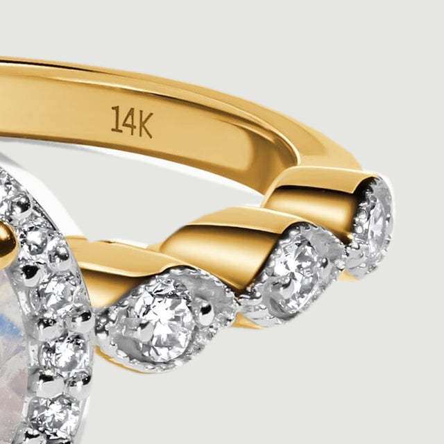 A 14K purity stamp is visible inside the polished yellow gold band above the diamond-set shoulder.