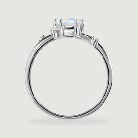 The white gold ring appears in profile with a raised oval stone and small diamond settings along the shoulders.