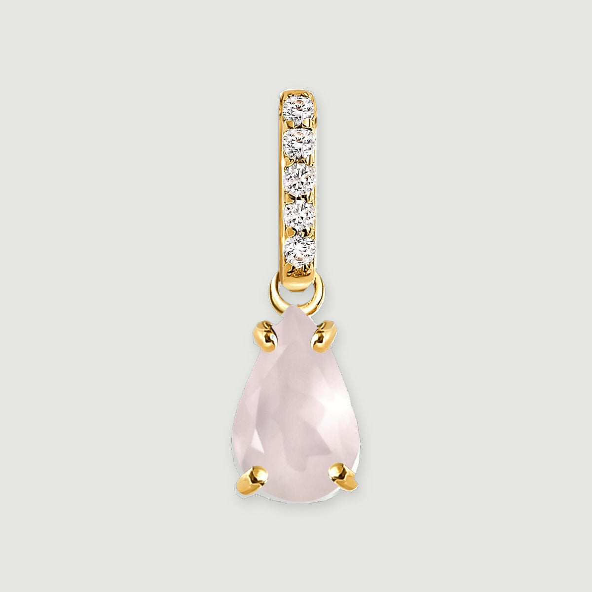 A pear-shaped pink rose quartz pendant hangs beneath a row of five clear stones in yellow gold on a light gray background.