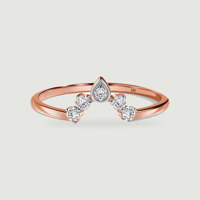A rose gold band curves beneath five bright diamonds in a pointed crown arrangement.