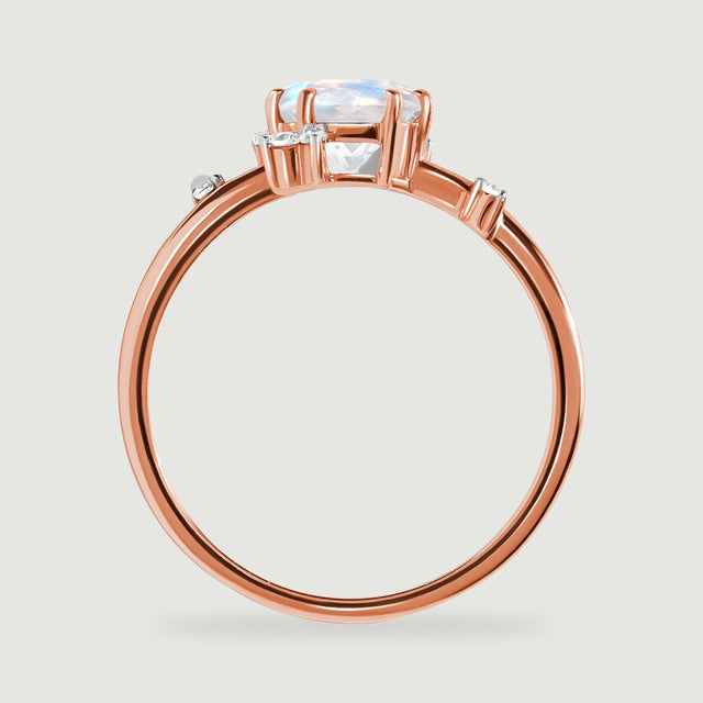 The rose gold ring is shown from the side with its open stone setting and slender circular band.