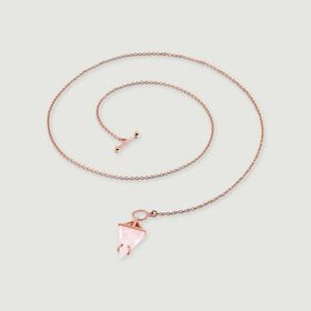 The rose gold chain curves above a pale pink pendant with an angular open setting and rounded prongs.