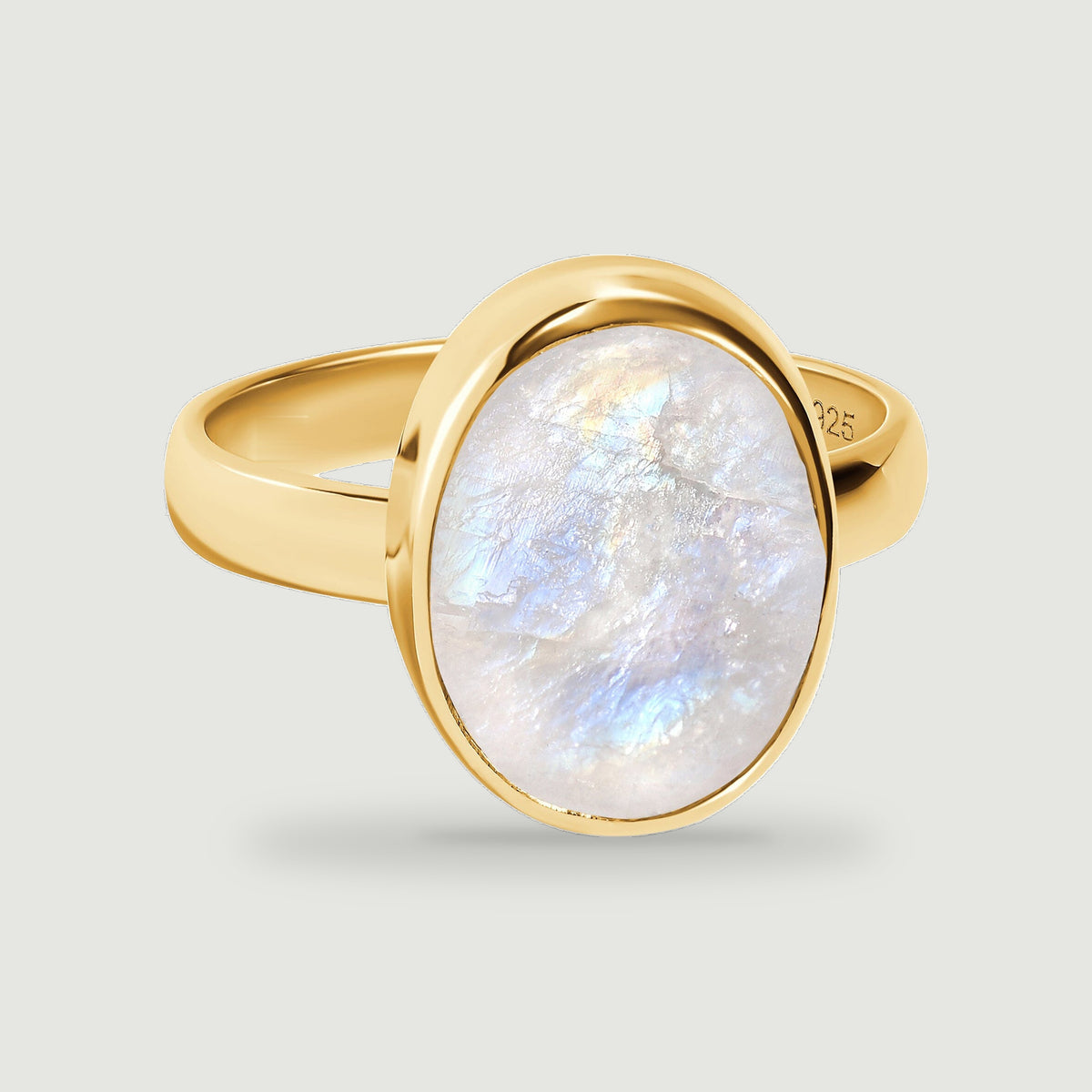 A textured oval moonstone is framed by a polished yellow gold vermeil bezel and band.