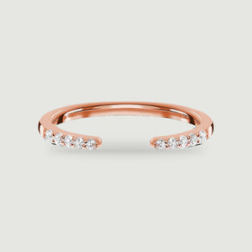 A rose gold open ring has five round diamonds on each end of its polished band.