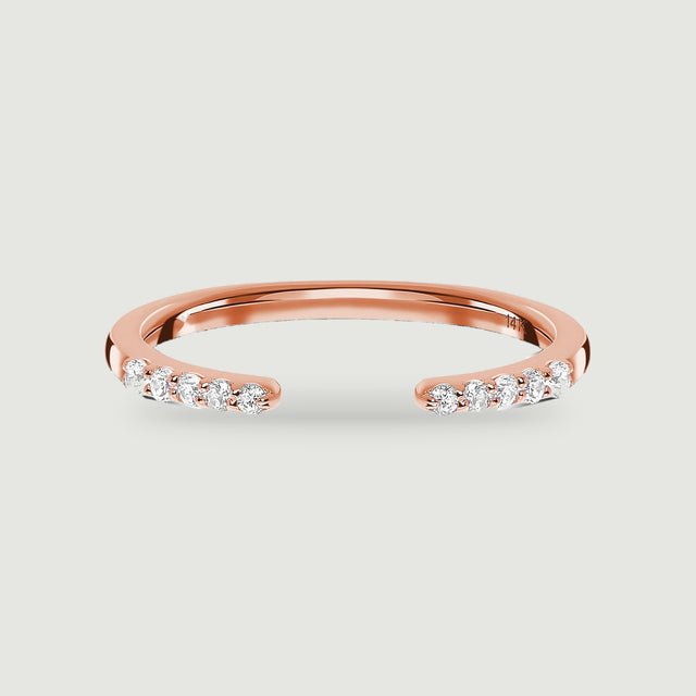 A rose gold open ring has five round diamonds on each end of its polished band.