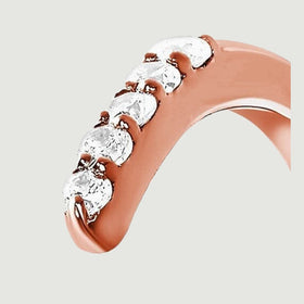 A close side view reveals individual diamond facets and the curved rose gold setting.