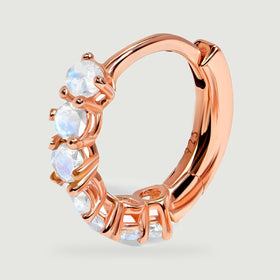 A single rose gold hoop shows individual moonstone settings and the smooth inner arc.