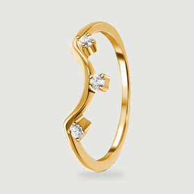 The side view of a yellow gold ring reveals an open circular band and three elevated stone settings.