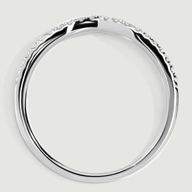 A white gold band is shown in profile with its circular shank and low diamond-set upper edge.