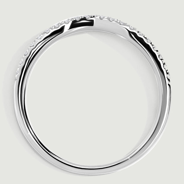 A white gold band is shown in profile with its circular shank and low diamond-set upper edge.
