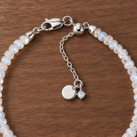 Close-up of the sterling-silver lobster clasp, extension chain and small charm on the Lunar Tide moonstone bracelet.