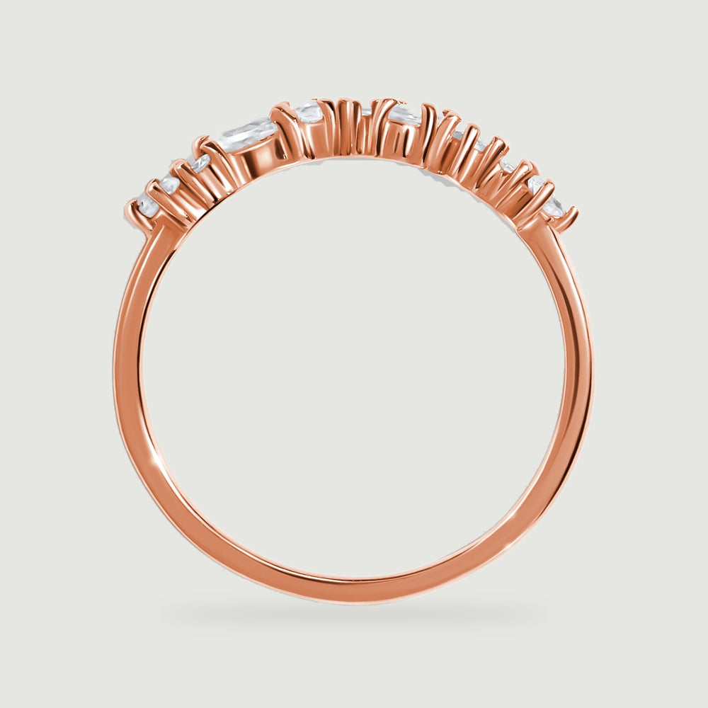 The rose gold ring is shown from the side with raised stone settings above its circular band.